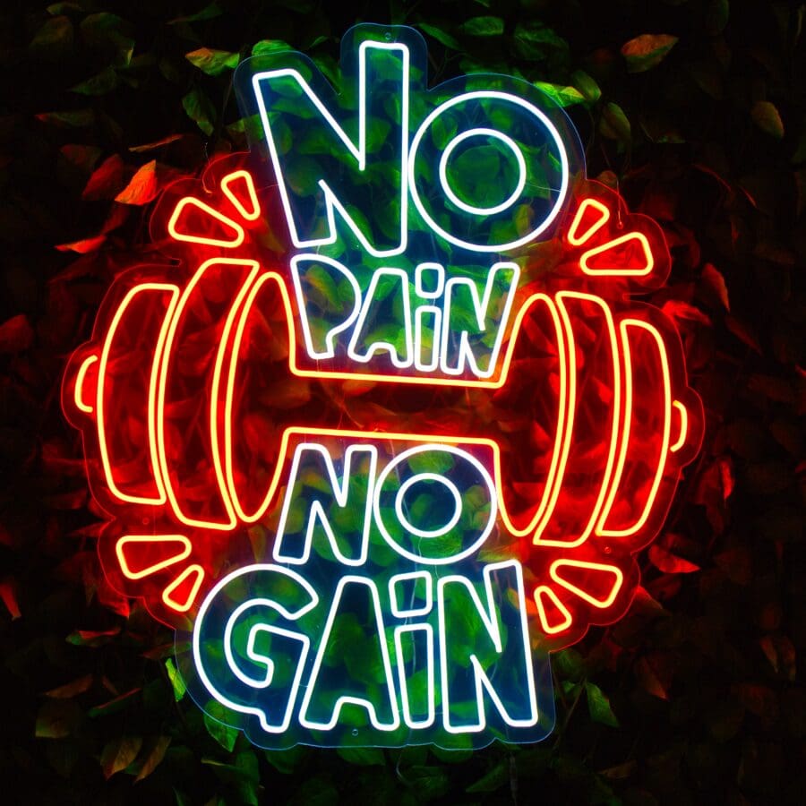 Un letrero de neón No Pain No Gain que muestra la frase "No Pain No Gain" con la imagen de una barra, iluminada en colores rojo, verde y amarillo.