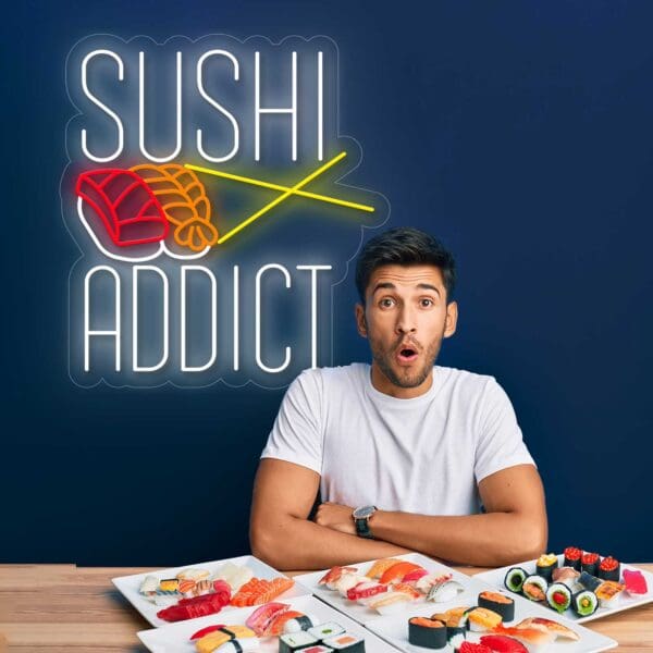 Un hombre sentado en una mesa del Neón Sushi Addict, rodeado de platos de sushi.