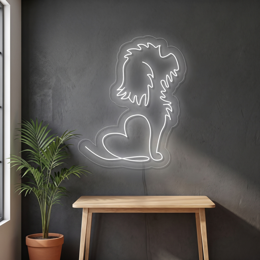 En una pared oscura, sobre una mesa de madera, hay un letrero de neón con forma de perro sentado y un corazón; junto a él hay una planta en una maceta.