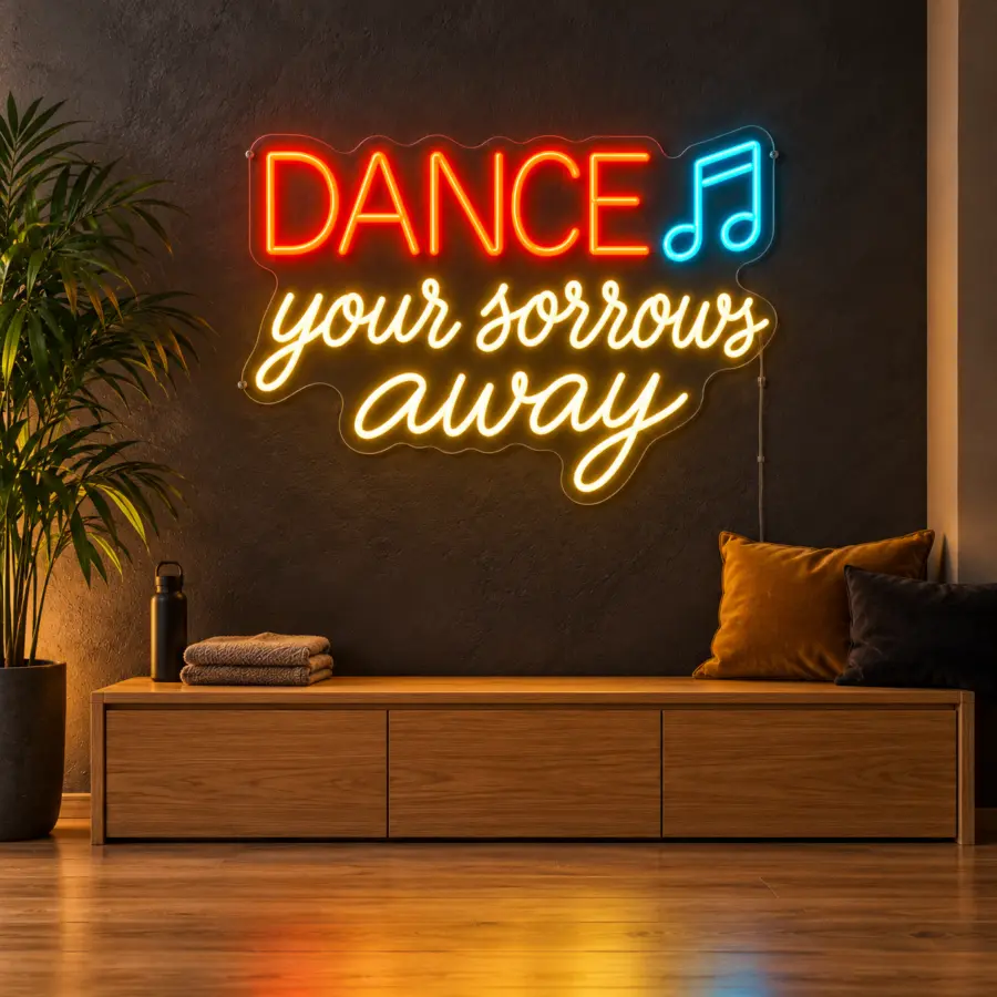 Montaje ambiental del cartel LED neón Dance your sorrows away en una esquina social de estudio de danza moderno, con pared de estuco carbón y banco de roble