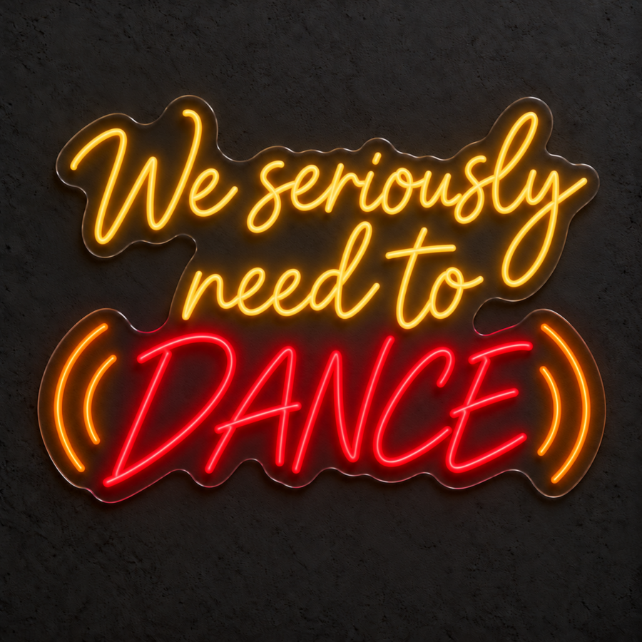 Visualización del neón LED «We seriously need to dance» en Amarillo dorado / Rojo / Naranja sobre pared neutra